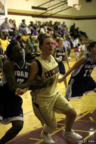 Kristin Portwine (right) battles for position against UQAM.